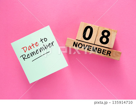 Date November 08 to remember concept with sticky note and wooden calendar 135914710