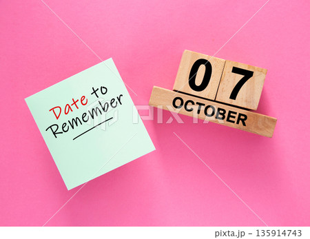 Date October 07 to remember concept with sticky note and wooden calendar 135914743
