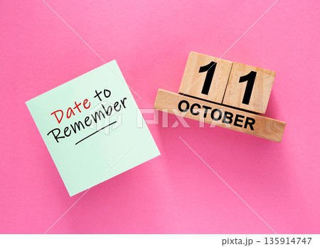 Date October 11 to remember concept with sticky note and wooden calendar 135914747