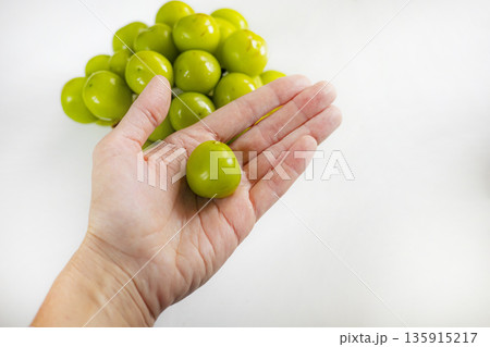 Close-up fresh green grape Shine Muscat in hand. Close-up fresh green grape Shine Muscat in hand. 135915217