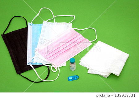 Battling coronavirus with vaccine vial and face masks 135915331