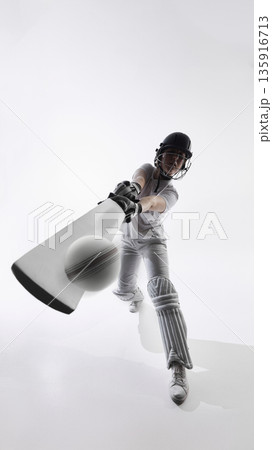 Female cricket player striking ball with bat during forward drive in studio 135916713