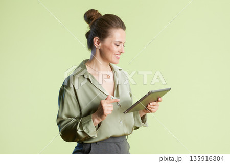 Creative woman using stylus and tablet 135916804
