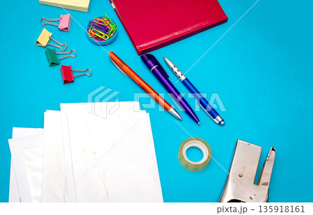 Business stationery details on blue background Business stationery details on blue background 135918161