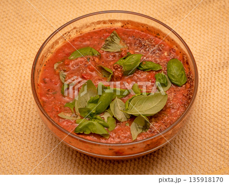 Tomato basil cream soup in bowl Tomato basil cream soup in bowl 135918170