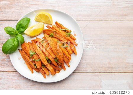Roasted sweet potato fries with basil and lemon Roasted sweet potato fries with basil and lemon 135918270