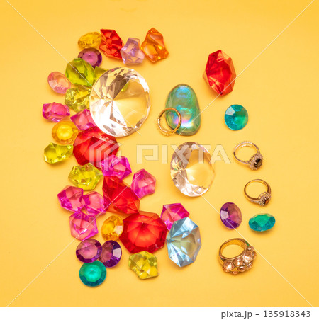 Gold rings and colorful precious gems Gold rings and colorful precious gems 135918343