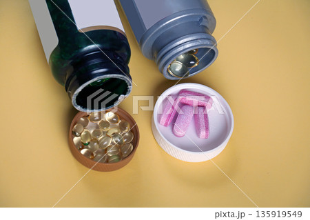 Vitamins pills inside bottles Vitamins pills inside bottles 135919549