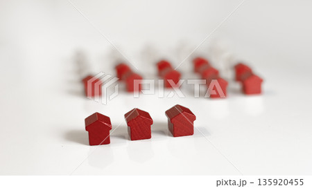Small red figure of house. Real estate investing and property 135920455