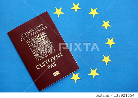 Czech biometrical passport on European Union flag background. Concept of citizenship of Czech Republic 135921554
