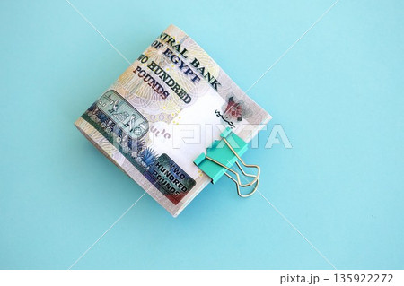 Egyptian pound money bills in big amount on blue close up. Finance and banking concept Egyptian pound money bills in big amount on blue close up. Finance and banking concept 135922272