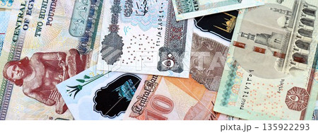 Egyptian pound currency money bills. The current banknotes lies on table in big amount close up 135922293