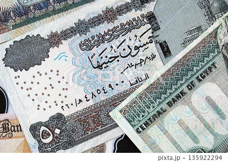 Egyptian pound currency money bills. The current banknotes lies on table in big amount close up 135922294