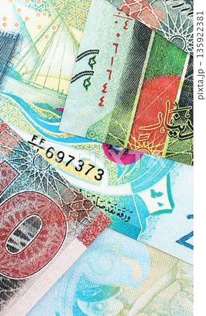 Kuwaiti dinar currency money bills. The current banknotes lies on table in big amount close up 135922381