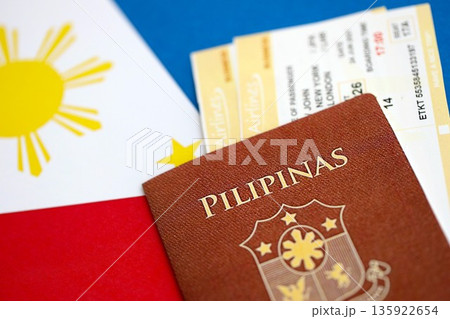 Philippines passport and boarding pass tickets on flag close up. The concept of travel and vacation 135922654