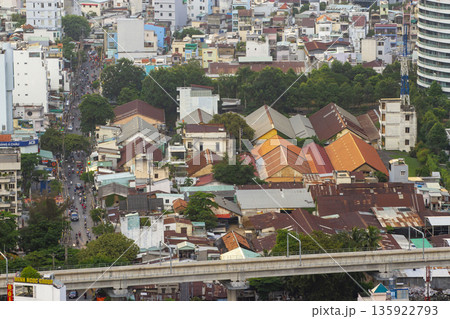 Aerial View Of Crowd Local Houses And Elevated Metro Railway In Ho Chi Minh City, Vietnam. Aerial View Of Crowd Local Houses And Elevated Metro Railway In Ho Chi Minh City, Vietnam. 135922793