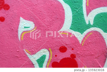 Colorful background of graffiti painting artwork with bright aerosol outlines on wall. Old school street art piece made with aerosol spray paint cans. Contemporary youth culture backdrop 135923016