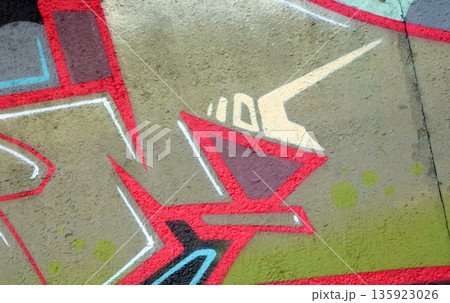 Colorful background of graffiti painting artwork with bright aerosol outlines on wall. Old school street art piece made with aerosol spray paint cans. Contemporary youth culture backdrop 135923026