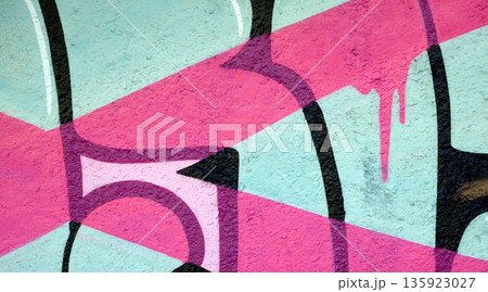 Colorful background of graffiti painting artwork with bright aerosol outlines on wall. Old school street art piece made with aerosol spray paint cans. Contemporary youth culture backdrop Colorful background of graffiti painting artwork with bright aerosol outlines on wall. Old school street art piece made with aerosol spray paint cans. Contemporary youth culture backdrop 135923027
