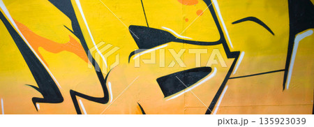Colorful background of graffiti painting artwork with bright aerosol outlines on wall. Old school street art piece made with aerosol spray paint cans. Contemporary youth culture backdrop Colorful background of graffiti painting artwork with bright aerosol outlines on wall. Old school street art piece made with aerosol spray paint cans. Contemporary youth culture backdrop 135923039