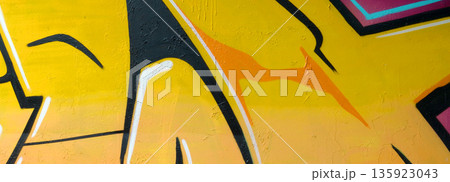 Colorful background of graffiti painting artwork with bright aerosol outlines on wall. Old school street art piece made with aerosol spray paint cans. Contemporary youth culture backdrop Colorful background of graffiti painting artwork with bright aerosol outlines on wall. Old school street art piece made with aerosol spray paint cans. Contemporary youth culture backdrop 135923043