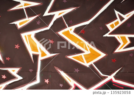 Colorful background of graffiti painting artwork with bright aerosol outlines on wall. Old school street art piece made with aerosol spray paint cans. Contemporary youth culture backdrop Colorful background of graffiti painting artwork with bright aerosol outlines on wall. Old school street art piece made with aerosol spray paint cans. Contemporary youth culture backdrop 135923058