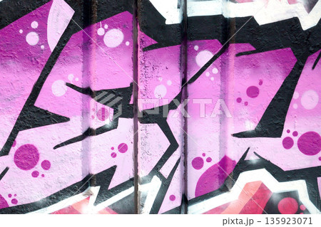 Colorful background of graffiti painting artwork with bright aerosol outlines on wall. Old school street art piece made with aerosol spray paint cans. Contemporary youth culture backdrop Colorful background of graffiti painting artwork with bright aerosol outlines on wall. Old school street art piece made with aerosol spray paint cans. Contemporary youth culture backdrop 135923071