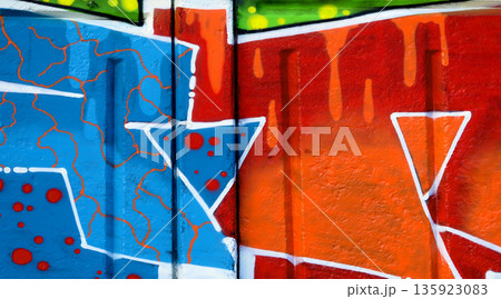 Colorful background of graffiti painting artwork with bright aerosol outlines on wall. Old school street art piece made with aerosol spray paint cans. Contemporary youth culture backdrop Colorful background of graffiti painting artwork with bright aerosol outlines on wall. Old school street art piece made with aerosol spray paint cans. Contemporary youth culture backdrop 135923083
