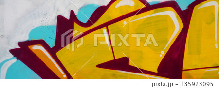 Colorful background of graffiti painting artwork with bright aerosol outlines on wall. Old school street art piece made with aerosol spray paint cans. Contemporary youth culture backdrop 135923095