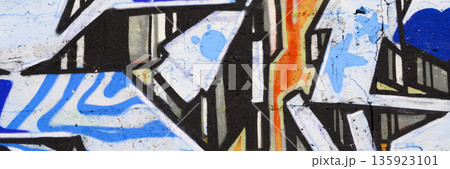 Colorful background of graffiti painting artwork with bright aerosol outlines on wall. Old school street art piece made with aerosol spray paint cans. Contemporary youth culture backdrop 135923101