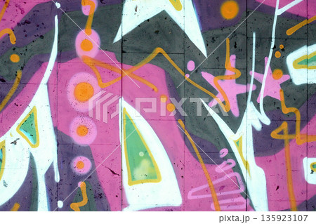 Colorful background of graffiti painting artwork with bright aerosol outlines on wall. Old school street art piece made with aerosol spray paint cans. Contemporary youth culture backdrop Colorful background of graffiti painting artwork with bright aerosol outlines on wall. Old school street art piece made with aerosol spray paint cans. Contemporary youth culture backdrop 135923107
