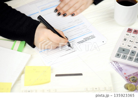 Accountant fill italian tax form F23 Payment model taxes duties penalties and other revenues in end of tax period. Taxation and paperwork routine in Italy Accountant fill italian tax form F23 Payment model taxes duties penalties and other revenues in end of tax period. Taxation and paperwork routine in Italy 135923365