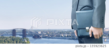 Businessman and skyline view. Businessman and skyline view. 135923625