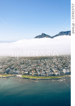 Helicopter view of Cape Town coastal city below thick cloud. South Africa mountain landscape. Stunning aerial panorama for travel tourism and postcard. 135923717