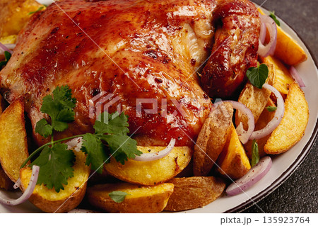fried, baked chicken, in the oven, with spices, and rustic potatoes, top view, homemade, fried, baked chicken, in the oven, with spices, and rustic potatoes, top view, homemade, 135923764