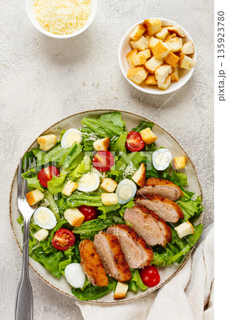 Caesar salad, with duck breast, on a light plate, on a light background, homemade, no people, Caesar salad, with duck breast, on a light plate, on a light background, homemade, no people, 135923780