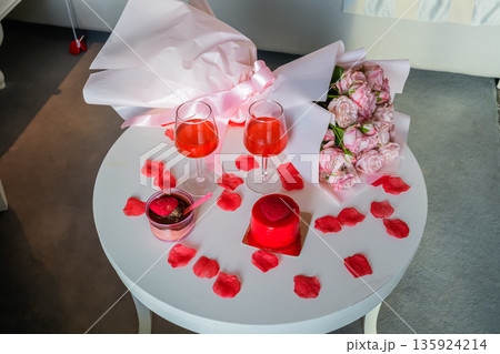 Top View of Table with Glasses Heart Desserts and Roses 135924214