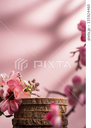Wood podium with pink flowers on soft pastel background Wood podium with pink flowers on soft pastel background 135924460