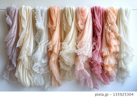 Attract premium clients. Diversity samples of a handmade French lace draped hanging on a white background. Attract premium clients. Diversity samples of a handmade French lace draped hanging on a white background. 135925304