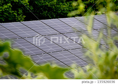 House roof with photovoltaic modules. Historic farm house with modern solar panels on roof and wall High quality photo House roof with photovoltaic modules. Historic farm house with modern solar panels on roof and wall High quality photo 135926036