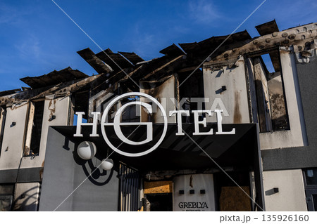 The charred remains of a boutique hotel show extensive fire damage blackened walls collapsed roof and exposed interior highlighting the destructive impact and vulnerability of urban structures. The charred remains of a boutique hotel show extensive fire damage blackened walls collapsed roof and exposed interior highlighting the destructive impact and vulnerability of urban structures. 135926160