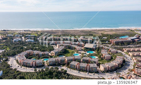 The Salgados resort in Albufeira, Portugal. The area features buildings, gardens, pools, and the coastline of the Algarve region The Salgados resort in Albufeira, Portugal. The area features buildings, gardens, pools, and the coastline of the Algarve region 135926347