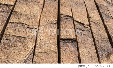 Natural Brown Stone Wall Vertical Panel Texture Background 3d render. 135927854