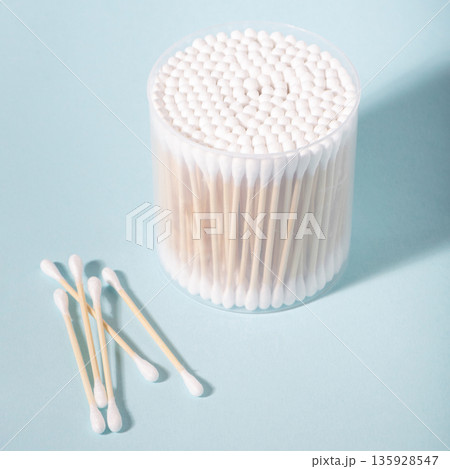 Cotton swabs in container for personal hygiene 135928547