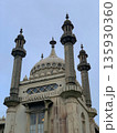 Brighton, UK, October 22, 2019 Brighton Royal Pavilion rooftop with central dome, four minarets, ornate balustrades and windows, under grey overcast sky. 135930360