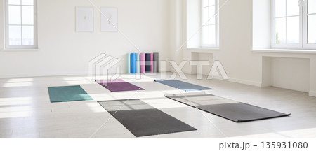 Sunlit yoga studio interior with mats on floor and bright windows, minimalist 135931080