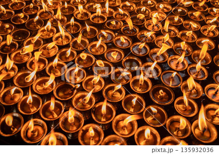 Light candles in Swayambhunath temple, Nepal. The faithful also light candles as a sign of gratitude to God for answered prayers. 135932036