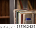 Many book shelves in a library 135932425