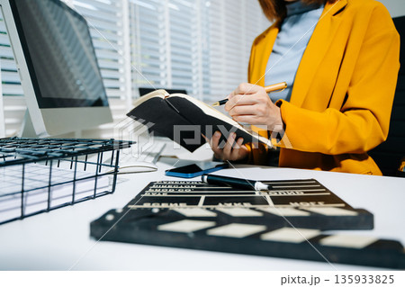 Businesswoman in yellow blazer planning strategy with charts and reports, perfect for corporate, teamwork, and office productivity concepts. Businesswoman in yellow blazer planning strategy with charts and reports, perfect for corporate, teamwork, and office productivity concepts. 135933825