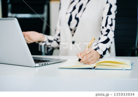 Businesswoman utilizing smartphone and tablet technology. Perfect for corporate, technology, Businesswoman utilizing smartphone and tablet technology. Perfect for corporate, technology, 135933934